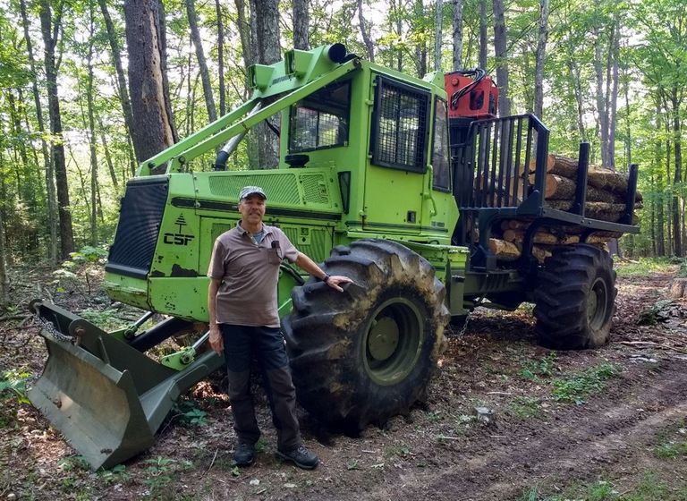 Brian Szyndlar with his logging tractor.