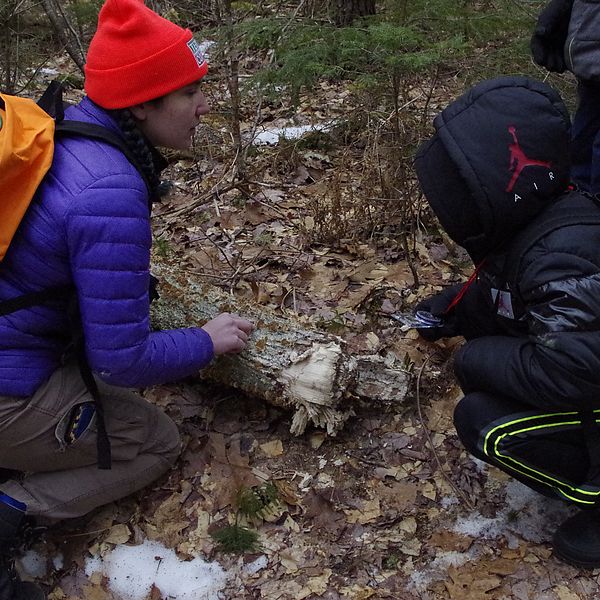 Youth Education Coordinator Amanda teaching children about fungi in the outdoors